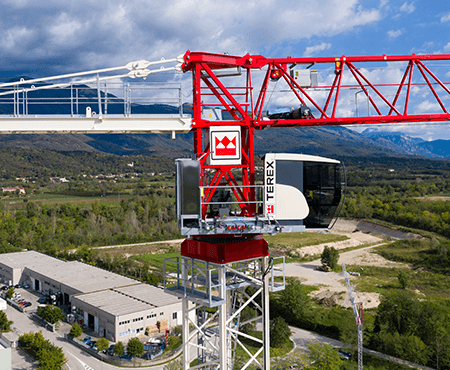 Terex Flat Top Tower Crane lifting materials at a construction site in the USA